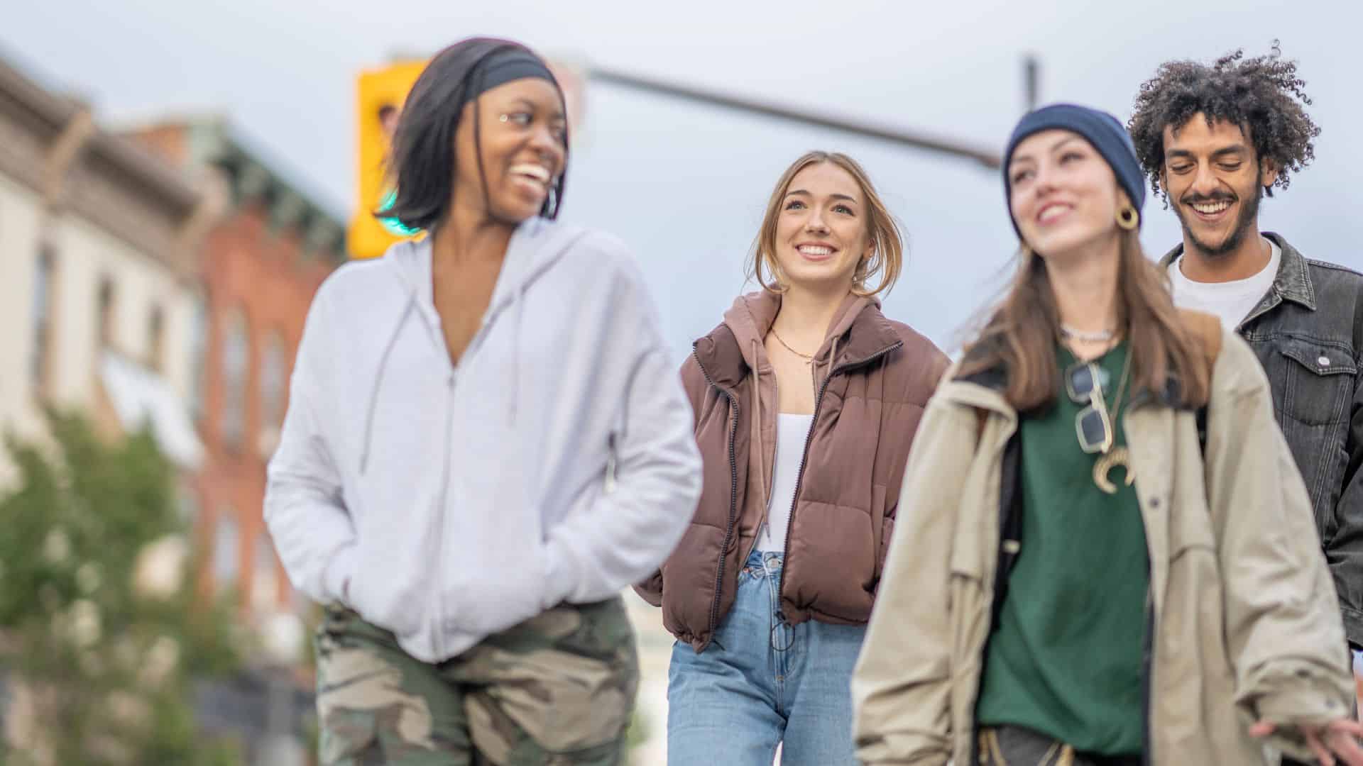 Youths-walking-along-street