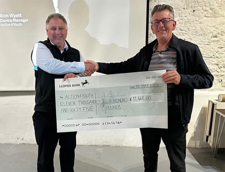 Rich Wyatt, Centre Manager at The Caldecotte Xperience receiving cheque from Steve Scott, Redways Runners.